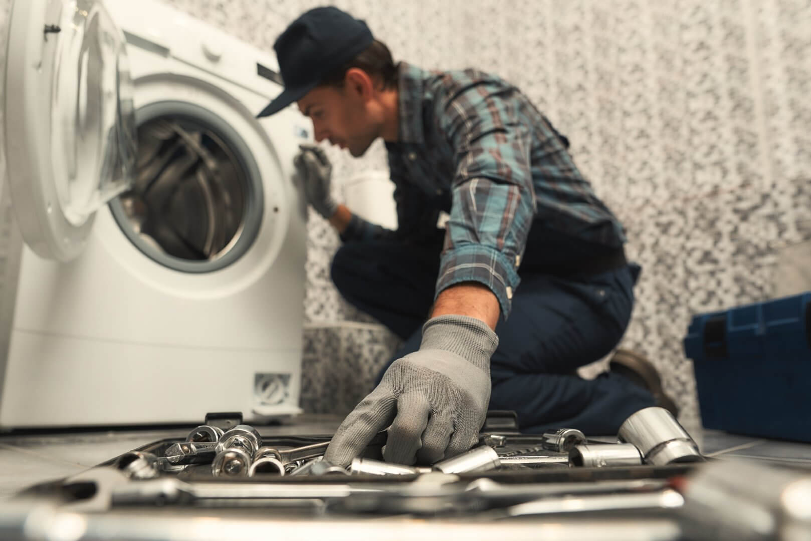 Dryer drum bearing inspection showing wear patterns with drum partially removed for access